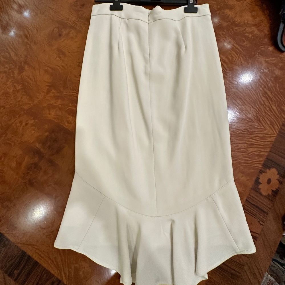 Midi skirt, incredibly flattering slimming cut and NWT.  Size 4
